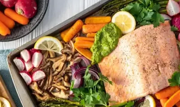 Organic produce and meat on a sheet pan